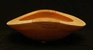 warped green cherry wood bowl