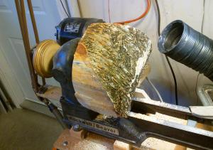 Wood mounted on lathe