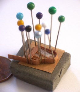 pinning the frame of a grand piano in the making by Maarten Meerman Max